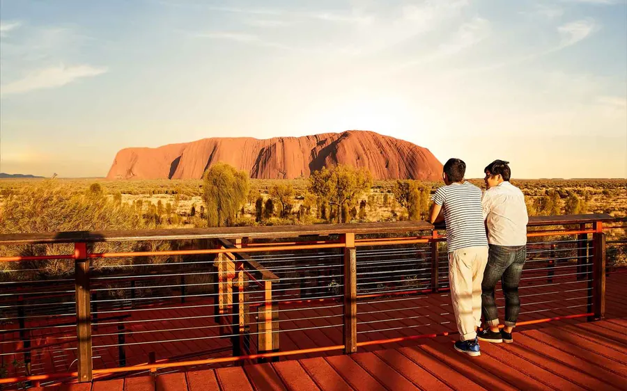 The rounded red domes of Kata Tjuta seen from a walking track between them